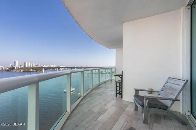 a view of a lake with houses in the back