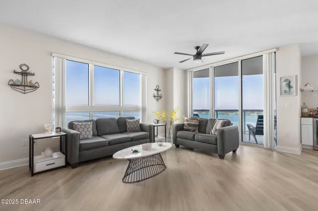 a bedroom with a bed and flat tv screen on the dresser