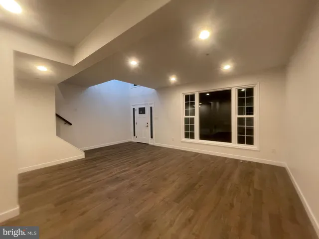 a view of empty room with windows