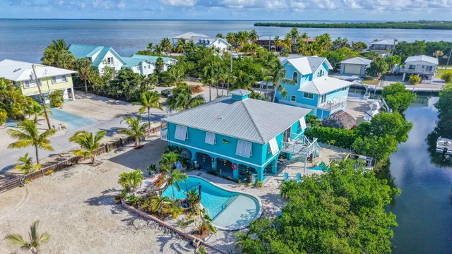 an aerial view of a house with a balcony