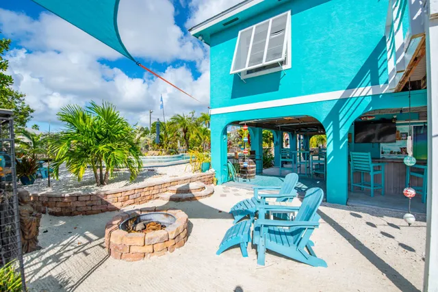a patio with a yard table and chairs