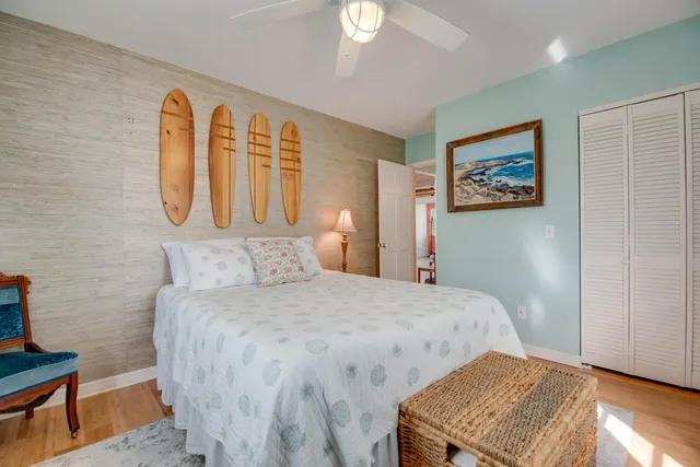 a bathroom with a granite countertop sink a toilet and a mirror