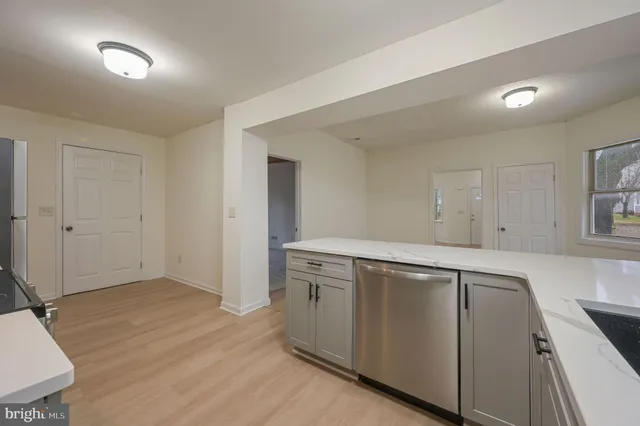 a view of a kitchen with electric appliances