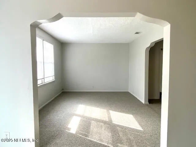 a view of a kitchen with a sink and a window