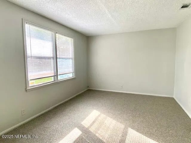 a kitchen with granite countertop a sink and cabinets
