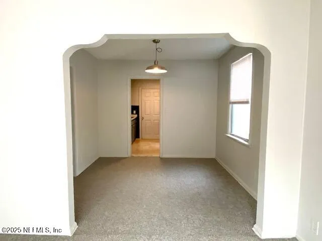 a kitchen with stainless steel appliances granite countertop a stove and a refrigerator