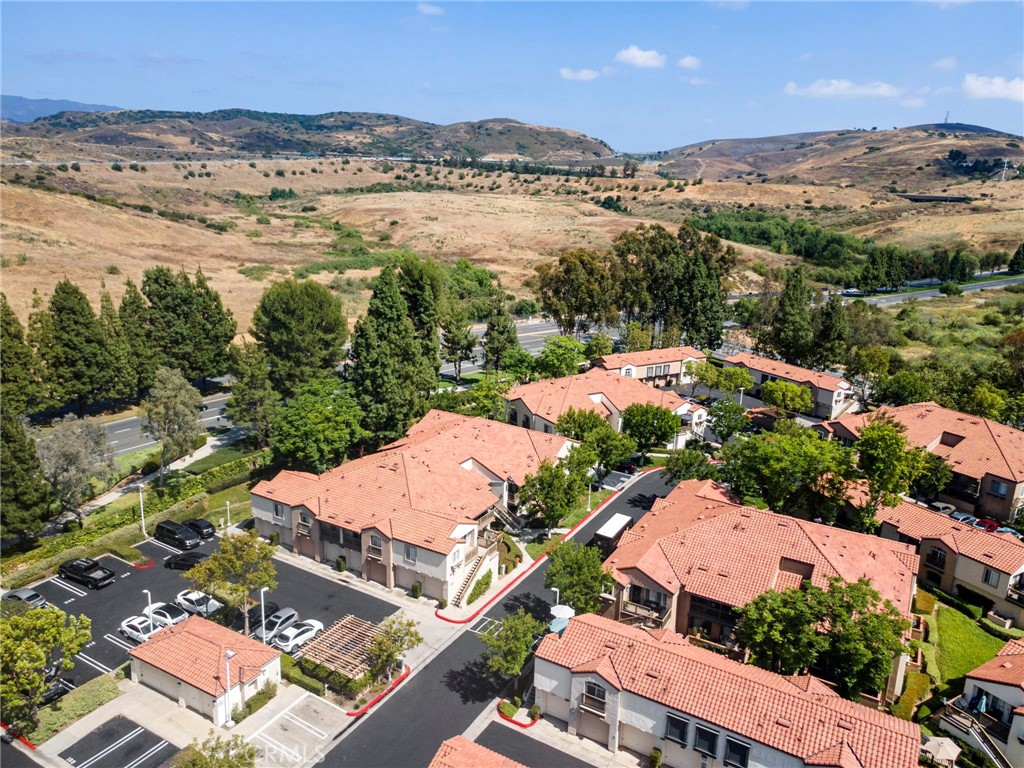 215 South Cross Creek Road, Unit L Orange, CA 92869 - Photo 47 of 50 an aerial view of residential houses with outdoor space and river