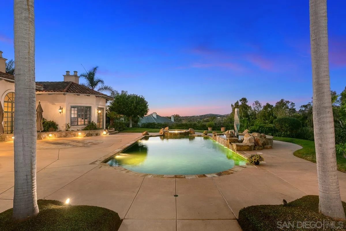 17178 Circa Oriente Rancho Santa Fe, CA 92067 - Photo 7 of 27 a view of a swimming pool with a table and chairs