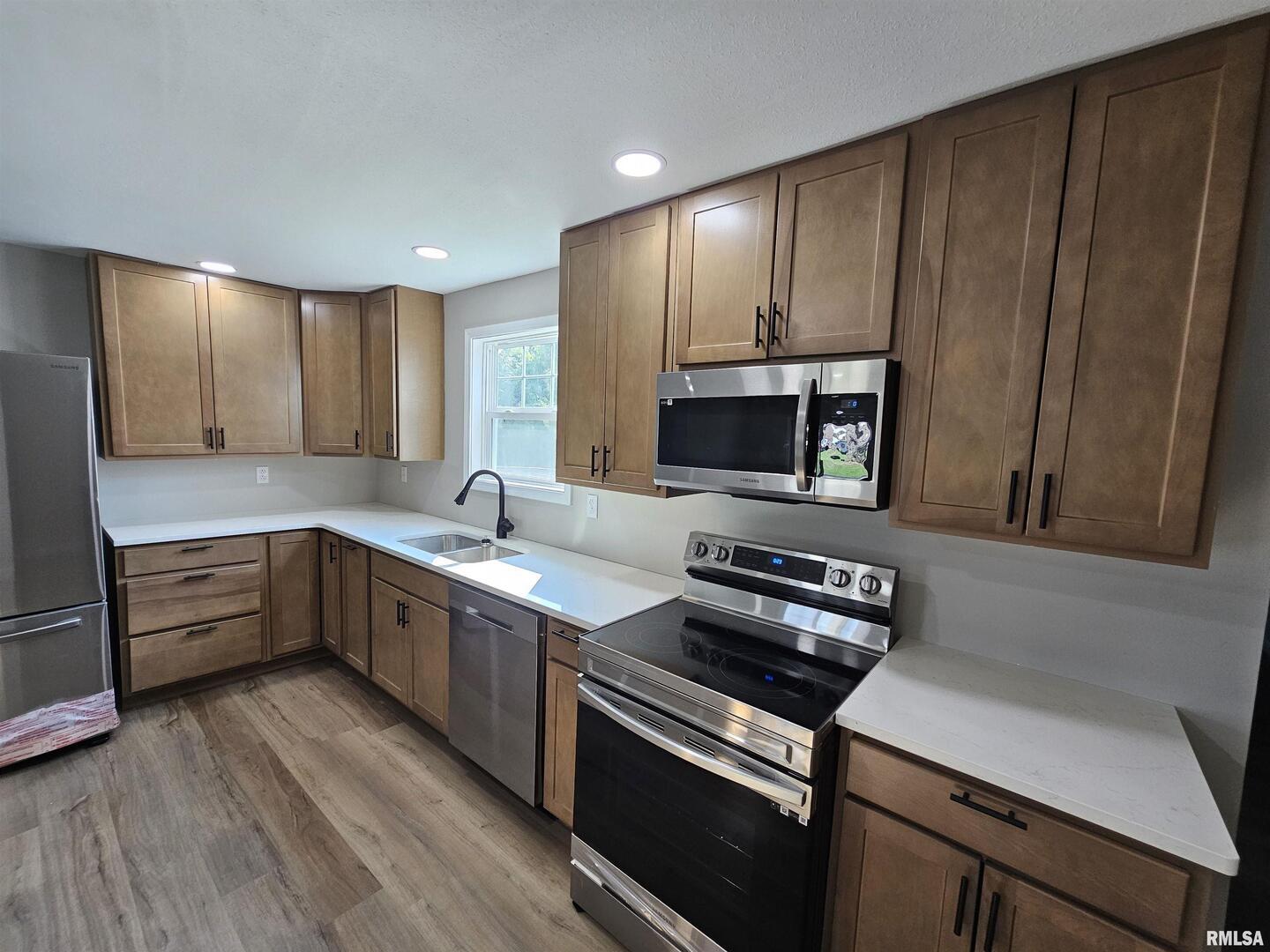 16530 East Fairfield Road Mount Vernon, IL 62864 - Photo 12 of 28 a kitchen with wooden cabinets and stainless steel appliances