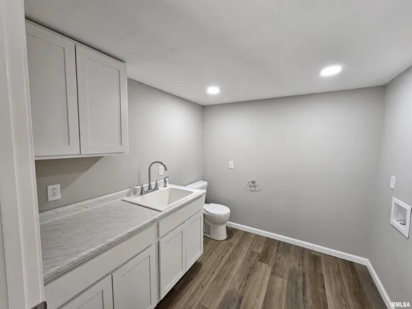 a bathroom with a sink and a toilet