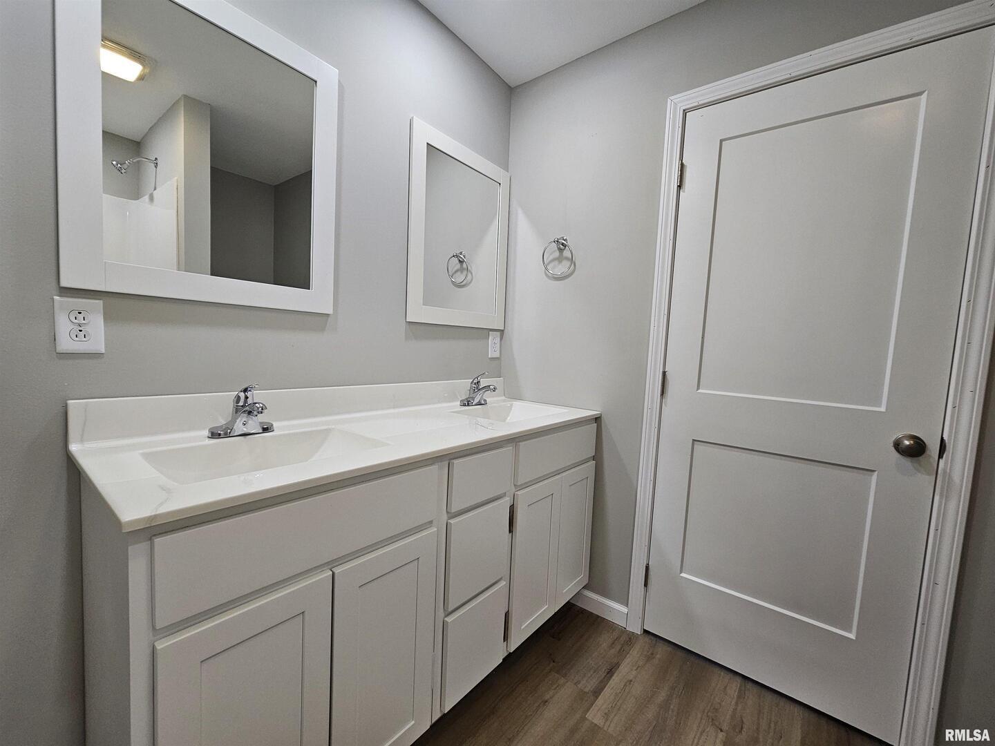 16530 East Fairfield Road Mount Vernon, IL 62864 - Photo 22 of 28 a bathroom with a double vanity sink and mirror