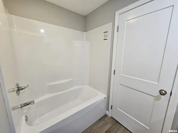 a bathroom with a sink toilet and a mirror