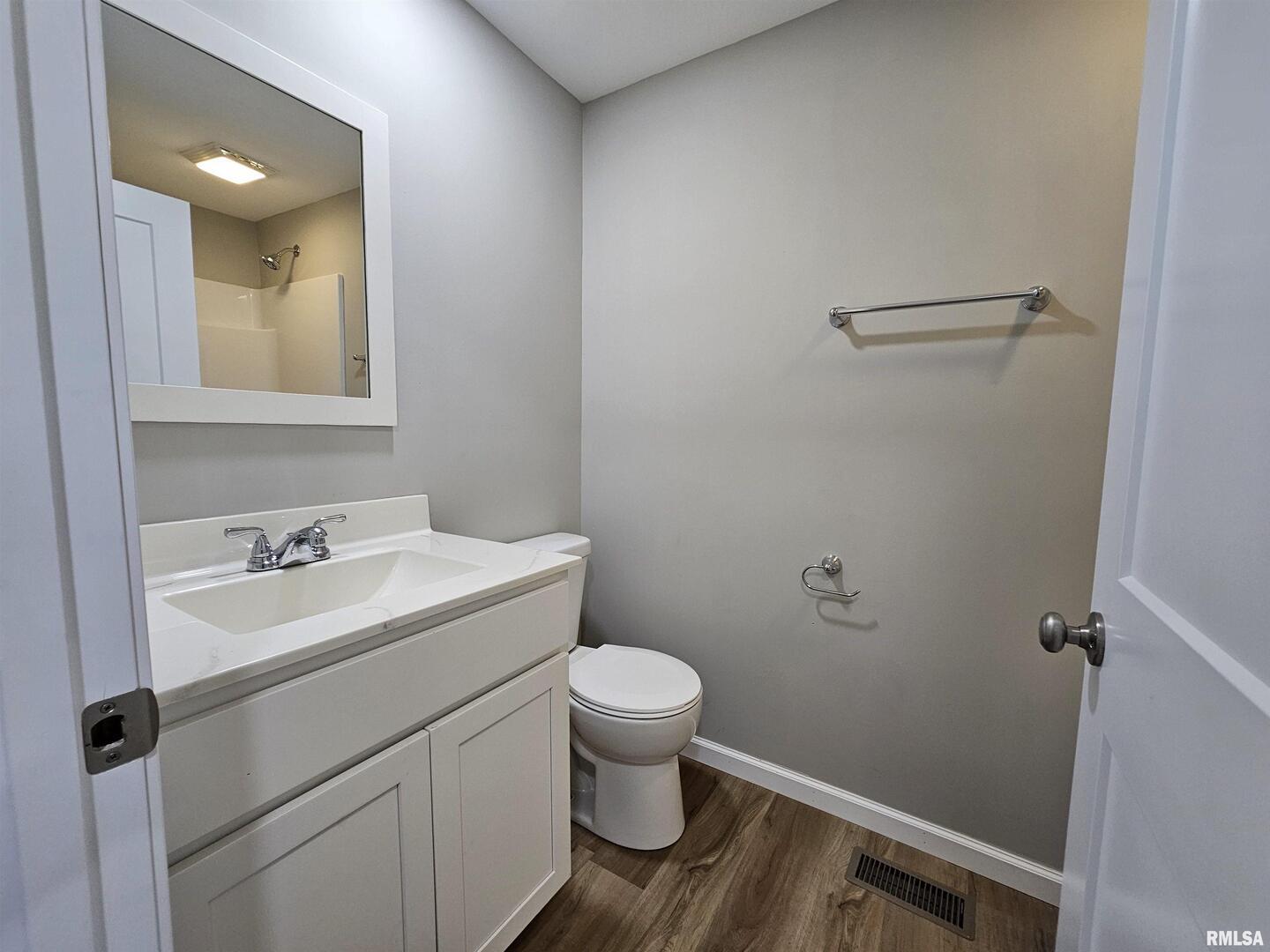 16530 East Fairfield Road Mount Vernon, IL 62864 - Photo 27 of 28 a bathroom with a sink toilet and a mirror