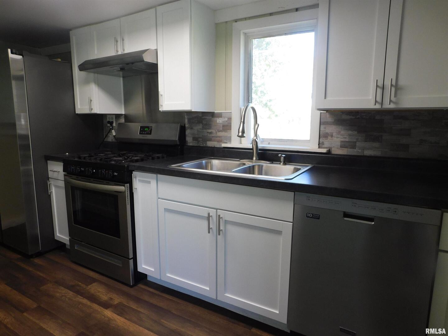 2517 Highway 17 Viola, IL 61486 - Photo 16 of 25 a kitchen with granite countertop white cabinets and a stove