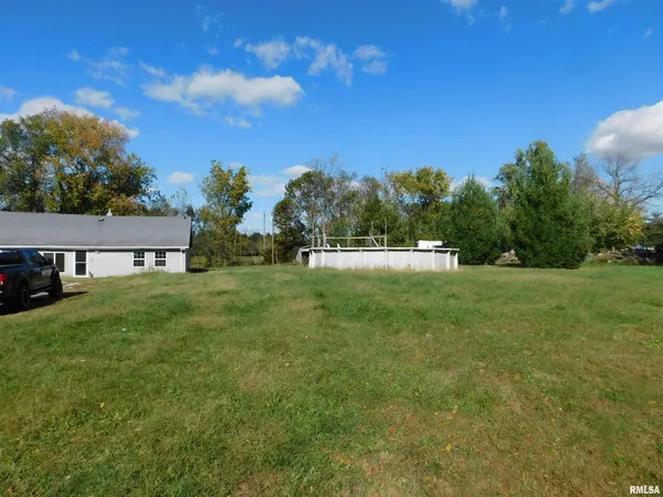 a view of backyard with green space