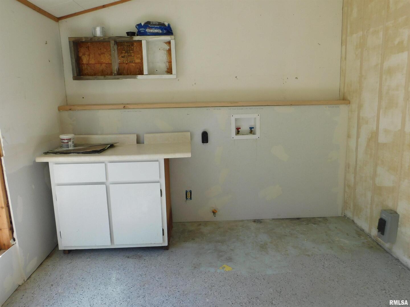 2517 Highway 17 Viola, IL 61486 - Photo 6 of 25 a utility room with a sink a vanity and a mirror