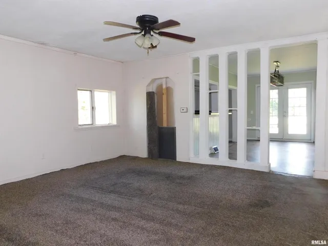 a view of an empty room with a window