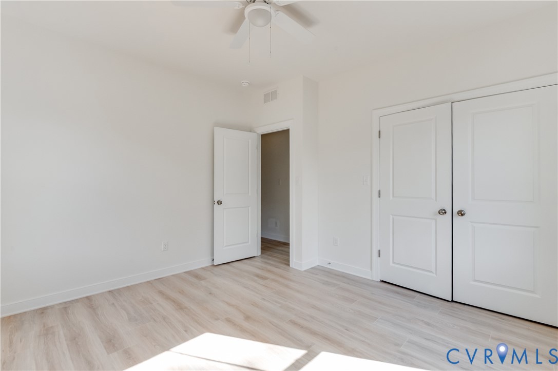 1393 Broad St Road Oilville, VA 23129 - Photo 19 of 39 Unfurnished bedroom featuring light wood-style flo