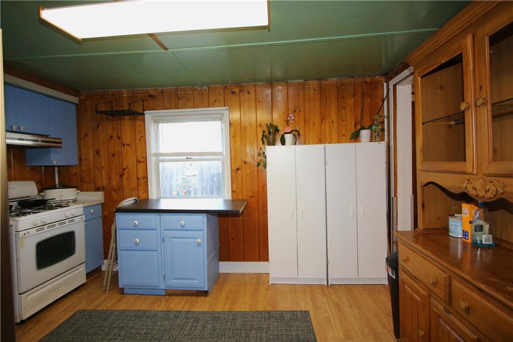102 10th Street Monongahela, PA 15063 - Photo 11 of 31 a kitchen with a refrigerator and a stove