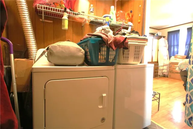 a kitchen with stainless steel appliances granite countertop a refrigerator and a stove