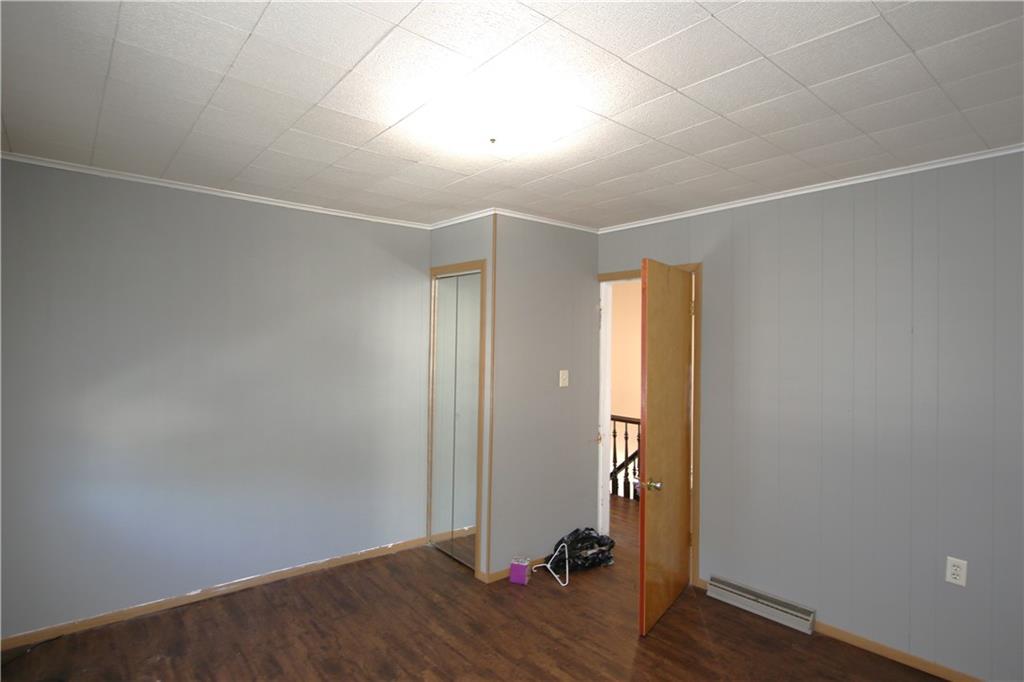 102 10th Street Monongahela, PA 15063 - Photo 18 of 31 an empty room with wooden floor and windows
