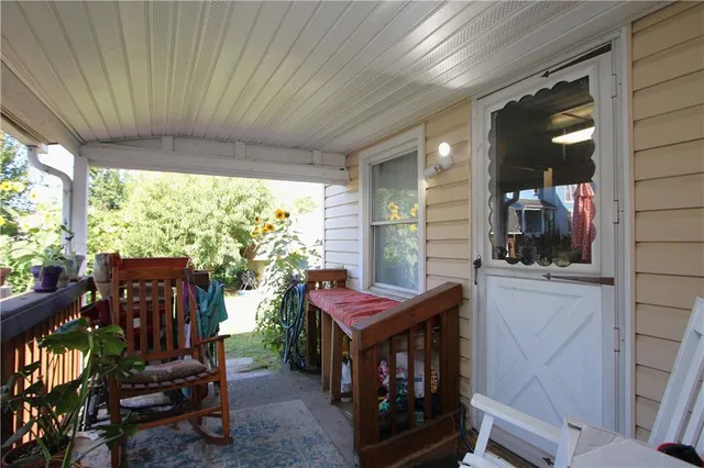 a view of a room with furniture and windows