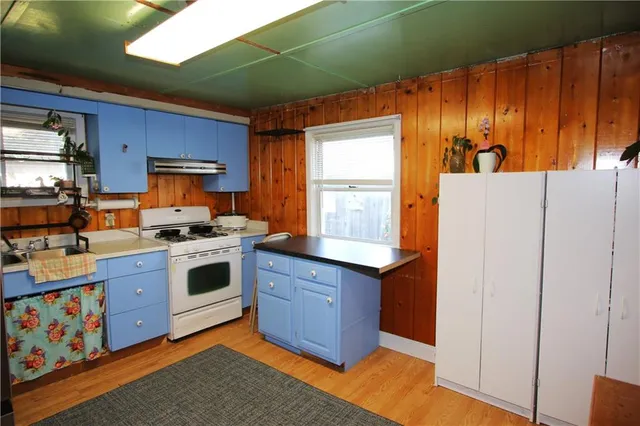 a bathroom with a toilet a sink and a window