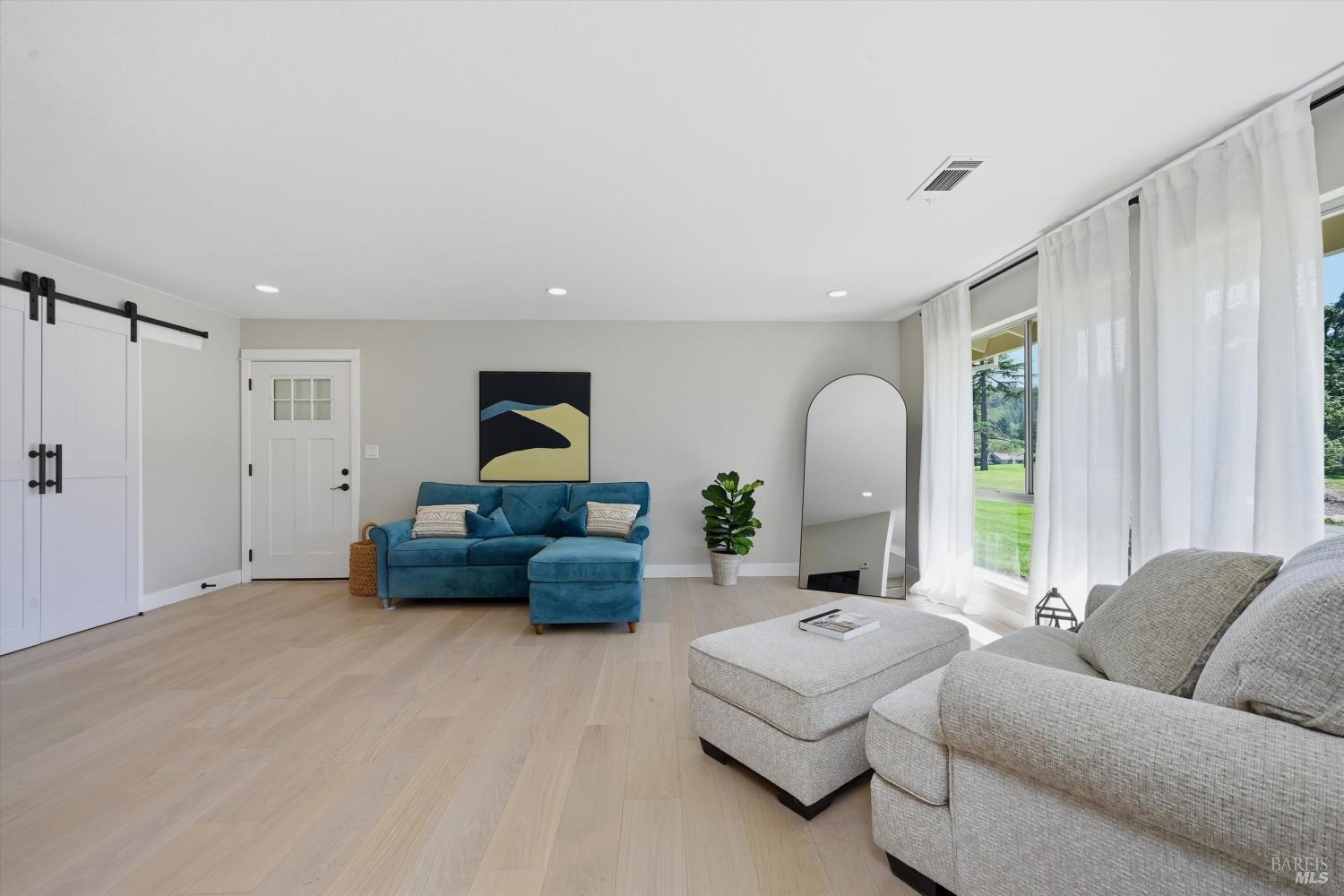 23 Valley Green Street Santa Rosa, CA 95409 - Photo 4 of 58 a living room with furniture and a window