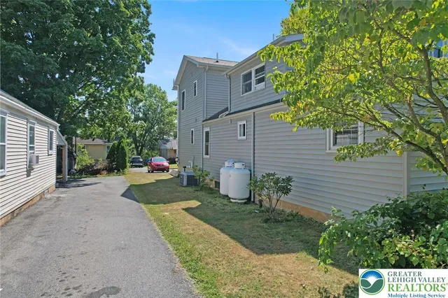 a bedroom with a bed and a table