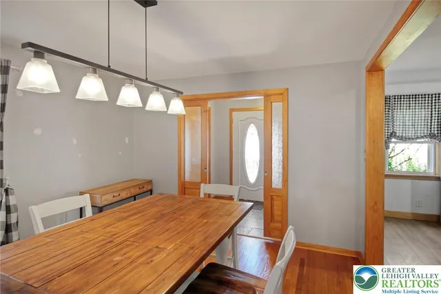 a kitchen with a sink cabinets stainless steel appliances and window