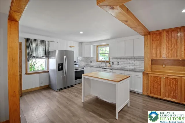 a view of a kitchen with wooden floor