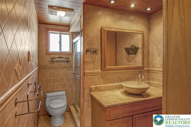 a view of empty room with window and wooden floor