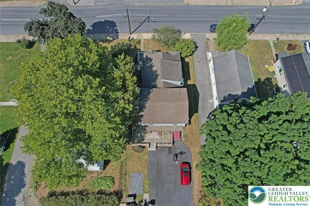 an aerial view of a house with outdoor space