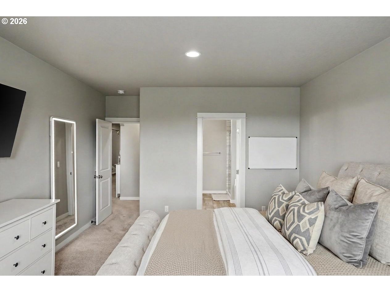 11862 Steinkamp Road Southeast Aumsville, OR 97325 - Photo 26 of 48 a bedroom with a bed and a flat screen tv
