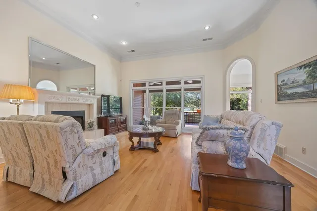 a living room with furniture fireplace and flat screen tv
