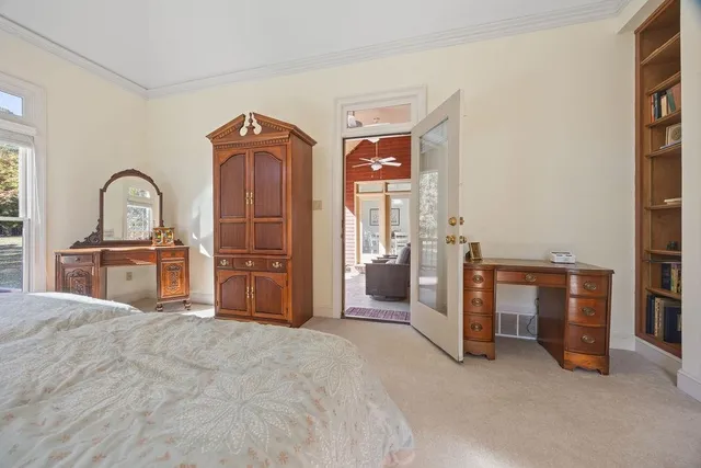 a view of a bedroom with closet and cabinet