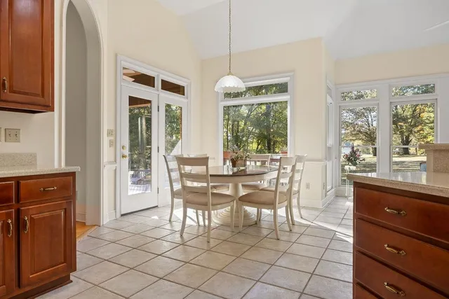 a dining room filled with furniture and window