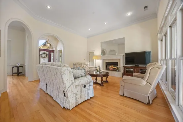 a living room with furniture fireplace and a flat screen tv