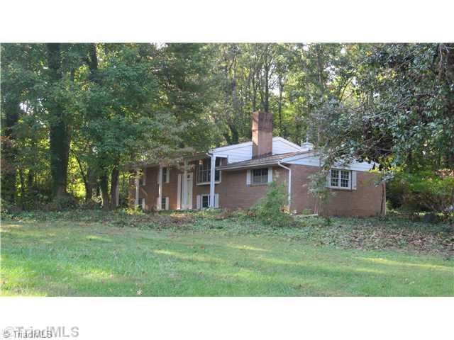 6420 Liberty Road Julian, NC 27283 - Photo 1 of 5 Exterior Front. Property sits on a high point on the property. There are great hardwoods and old growth plantings.