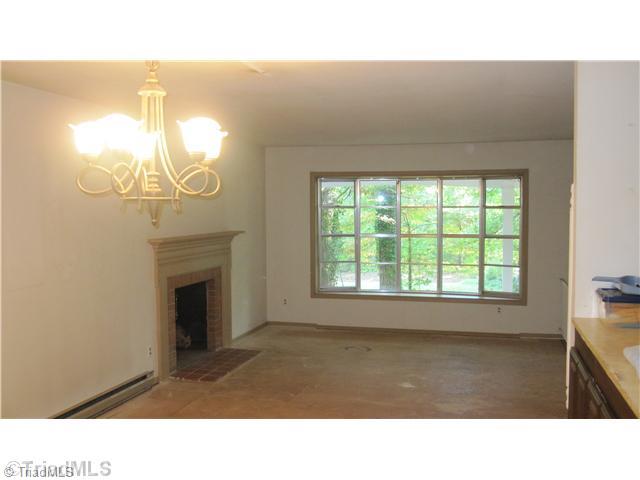 6420 Liberty Road Julian, NC 27283 - Photo 2 of 5 Living Room. This room has a wonderful bow window to let in light as well as a fireplace.