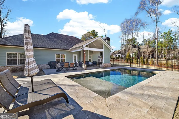 a view of a house with swimming pool