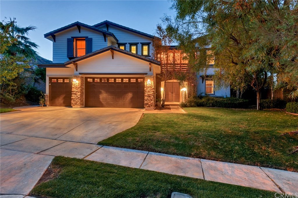 2470 Bulrush Circle Corona, CA 92882 - Photo 1 of 64 a front view of a house with a yard