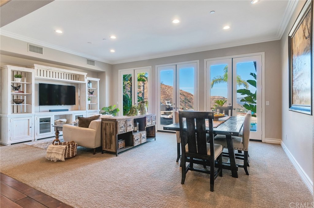 2470 Bulrush Circle Corona, CA 92882 - Photo 11 of 64 a view of a livingroom with furniture and a flat screen tv
