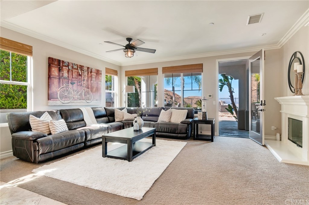 2470 Bulrush Circle Corona, CA 92882 - Photo 16 of 64 a living room with furniture and a large window