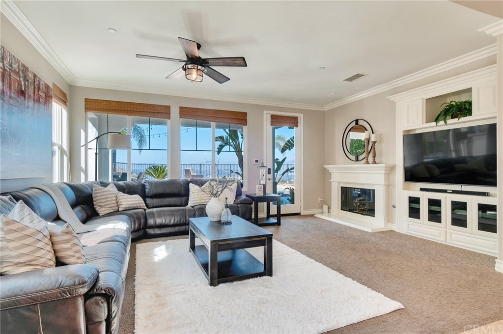 2470 Bulrush Circle Corona, CA 92882 - Photo 17 of 64 a living room with furniture fireplace and flat screen tv