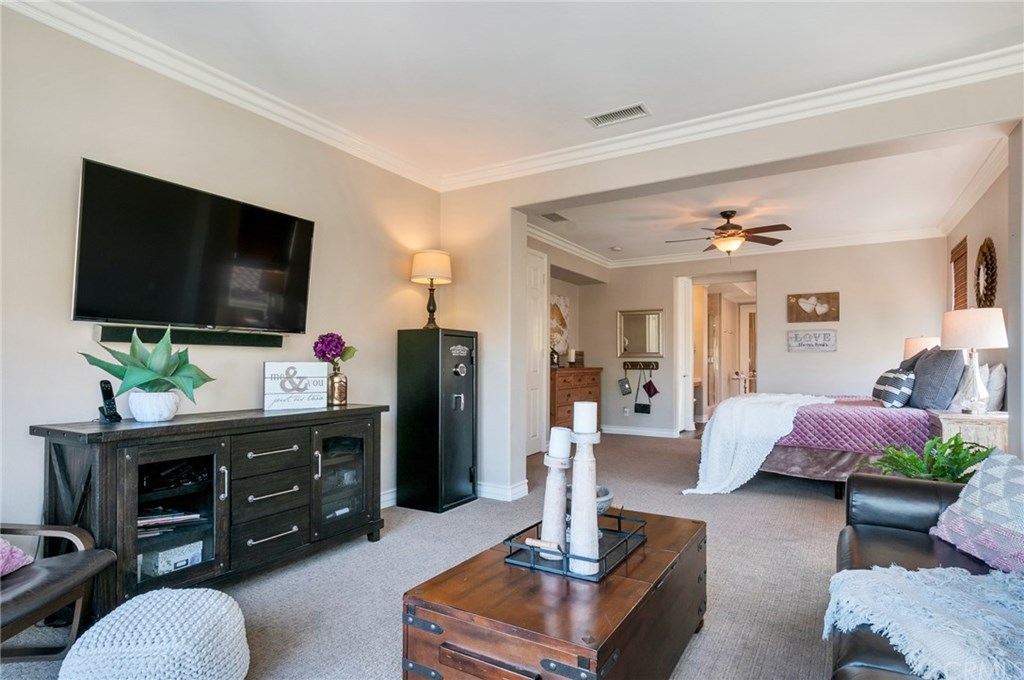 2470 Bulrush Circle Corona, CA 92882 - Photo 22 of 64 a living room with furniture and a flat screen tv