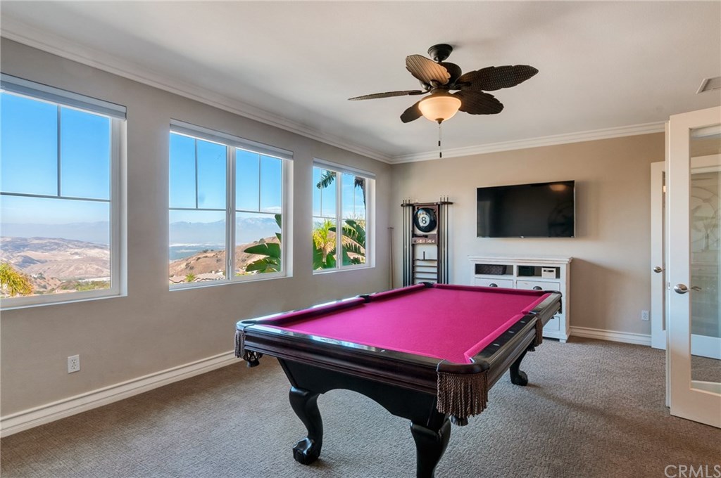 2470 Bulrush Circle Corona, CA 92882 - Photo 35 of 64 a room with pool table flat screen tv and windows