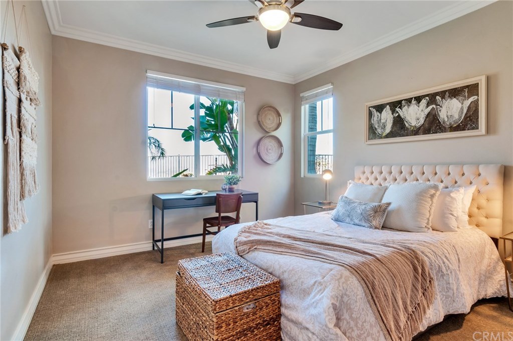 2470 Bulrush Circle Corona, CA 92882 - Photo 43 of 64 a bedroom with a bed and a table in it with window