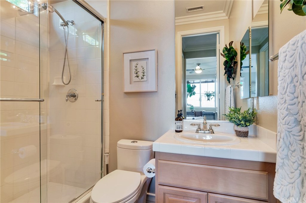 2470 Bulrush Circle Corona, CA 92882 - Photo 45 of 64 a bathroom with a sink toilet and shower