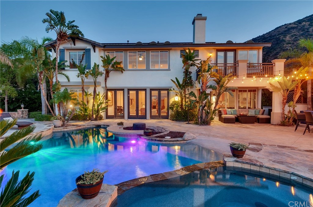 2470 Bulrush Circle Corona, CA 92882 - Photo 5 of 64 a front view of a house with swimming pool patio and outdoor seating